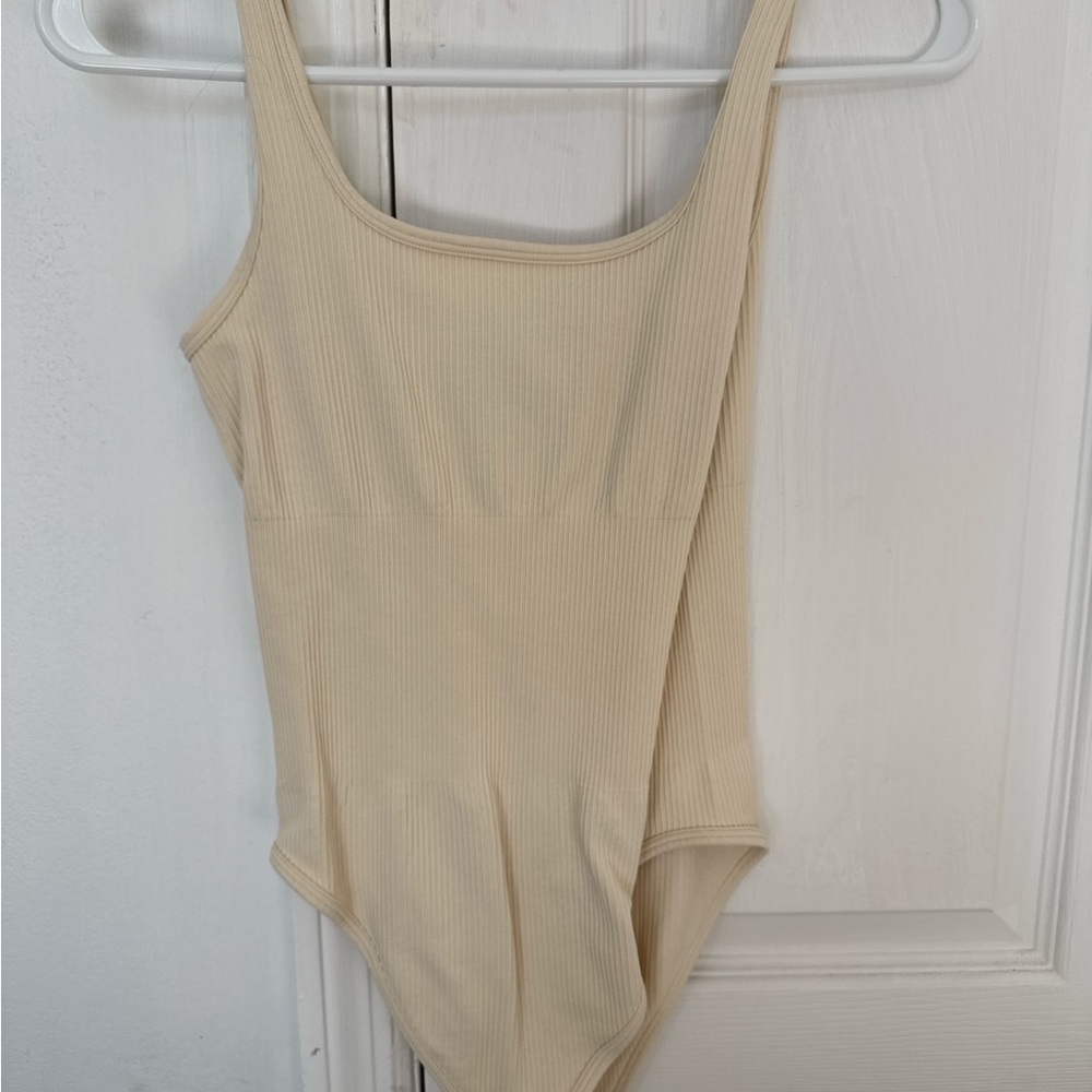Chic Beige Ribbed Bodysuit